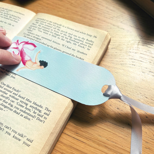 Cherry blossom luxury handmade bookmark used to read a book