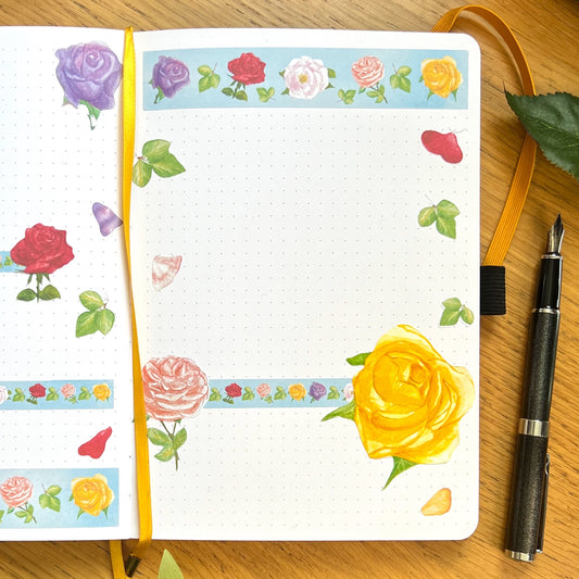 Journal page decorated with die cut, Washi strips and decorative stickers of roses in a variety of vibrant colours