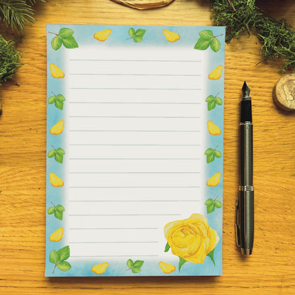 Yellow rose illustrated notepad with sky blue border decorated with yellow petals and leaves